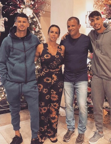 Cris Paqueta with her husband and two sons.